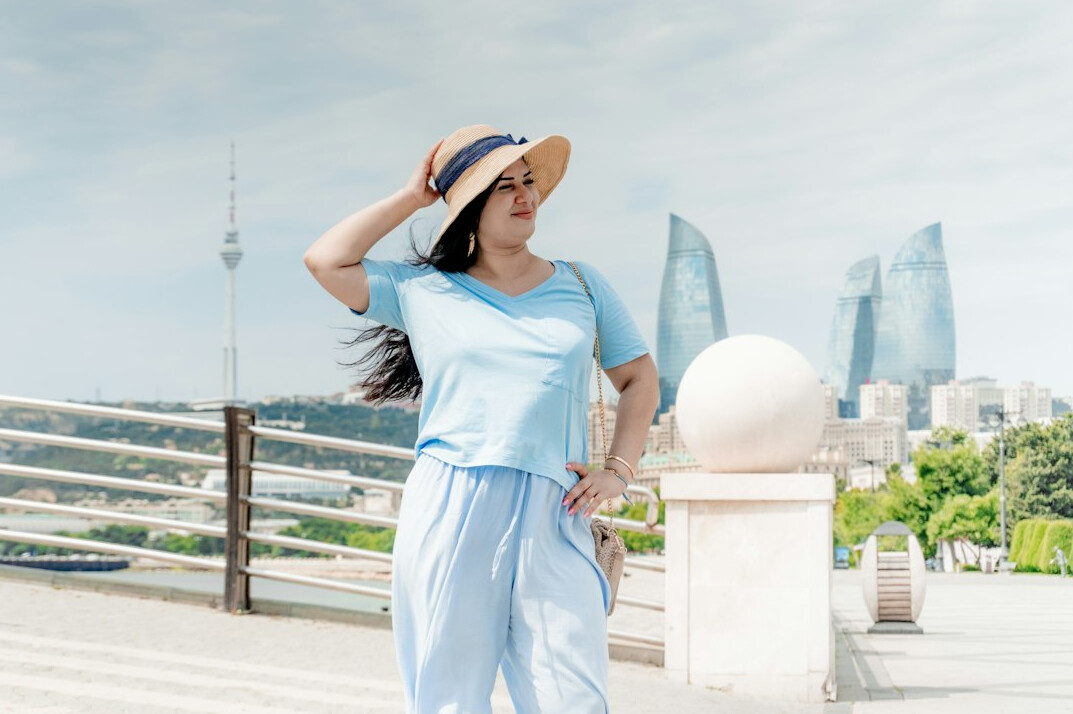 Portrait of a smiling Latin American woman in her forties with dark hair, friendly professional look