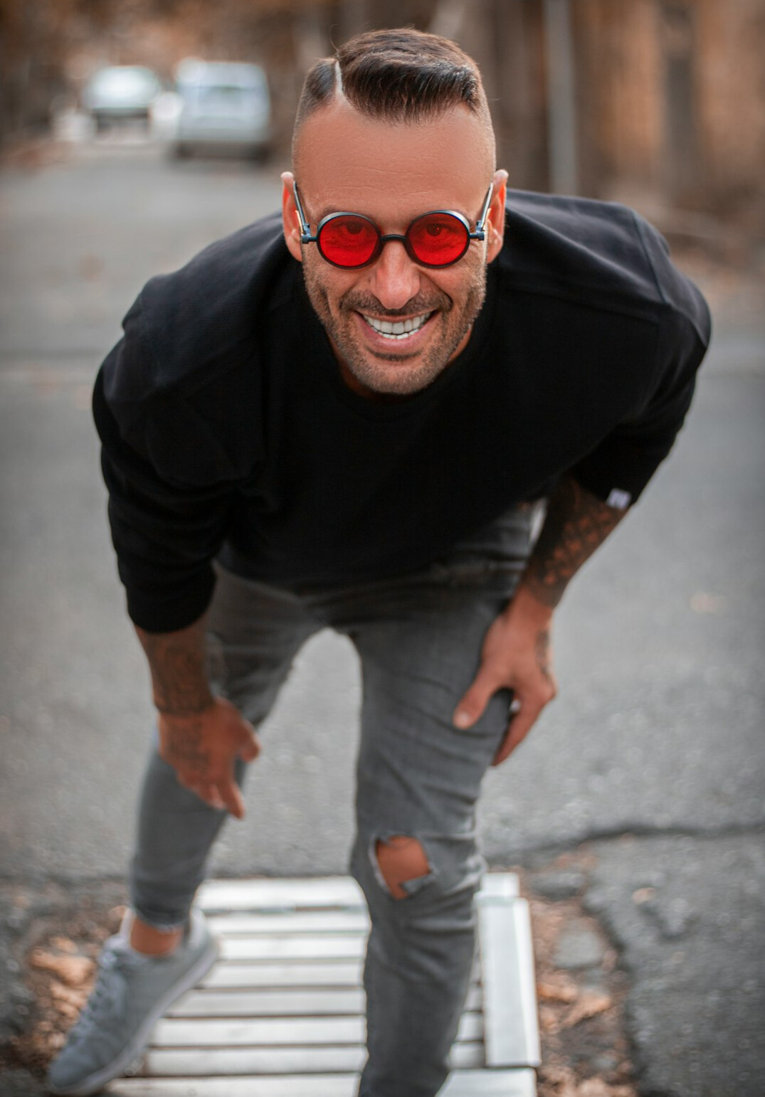 Portrait of a smiling Latin American man in his fifties with short grey hair and glasses