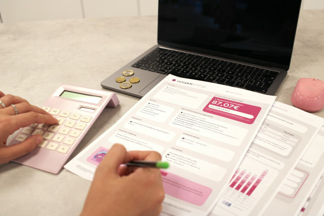 person writing financial goals on paper